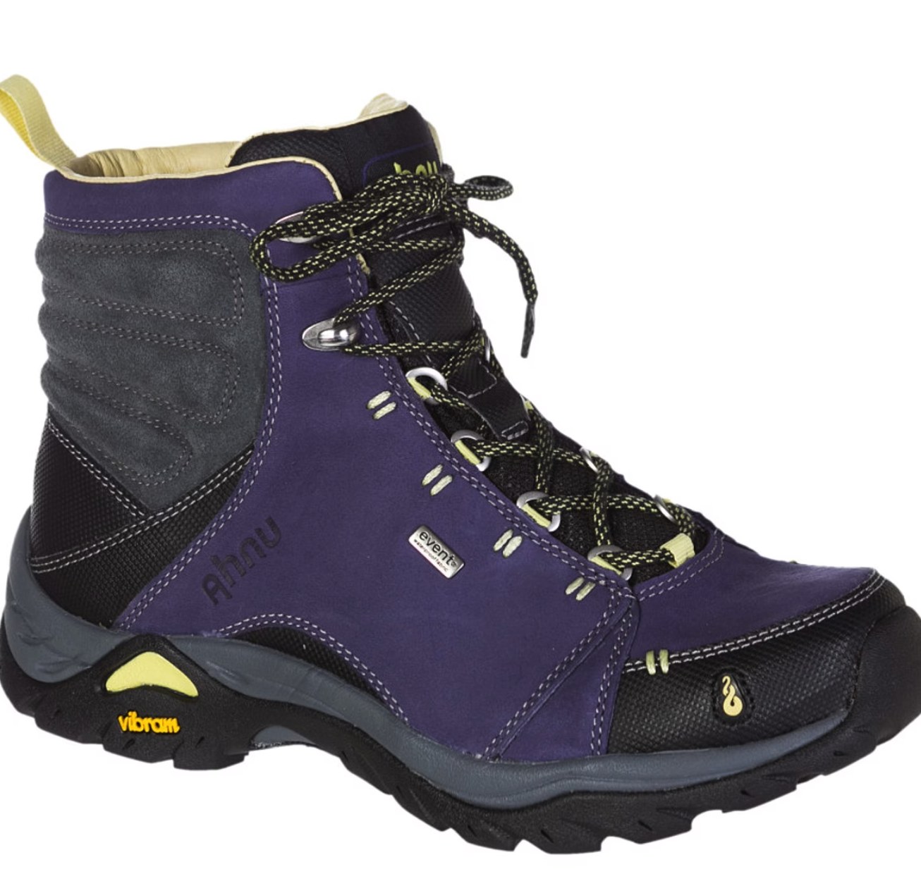 Ahnu hiking boot on a rocky mountain trail with forest background, showcasing rugged outdoor performance